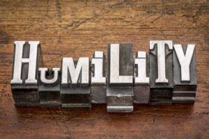 Humility spelled out in metal printing press letters in varying sizes