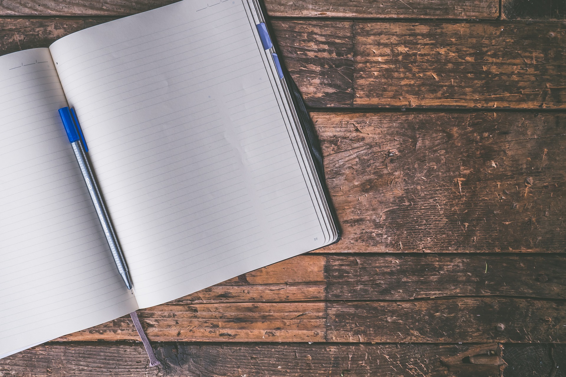 Empty journal on rustic wooden surface